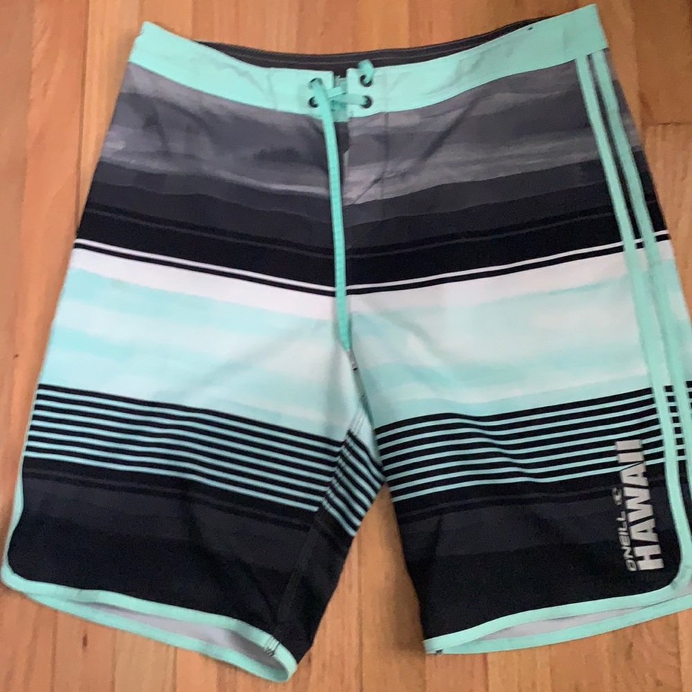 blue and black O’Neill board-shorts.
